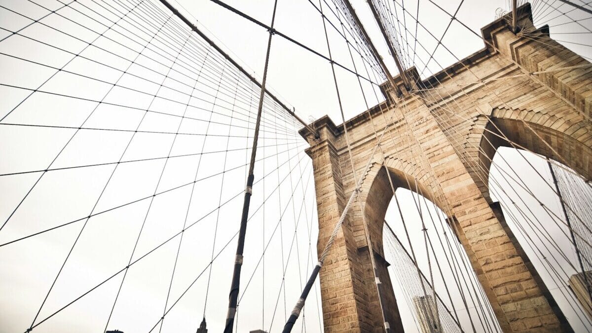cable bridge under white sky, Brooklyn Bridge in NYC