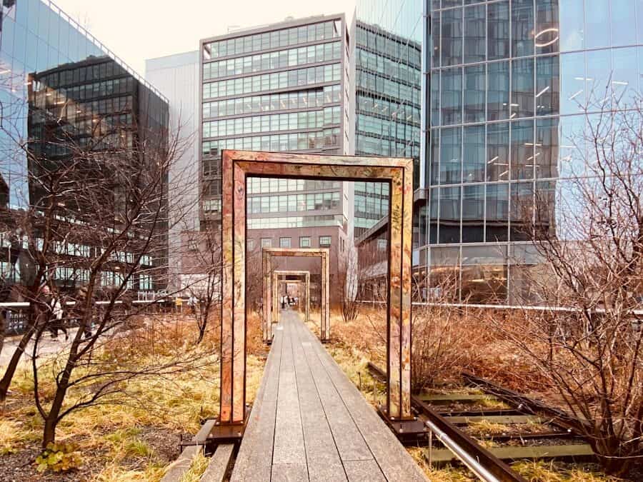 brown wooden train rail near glass building during daytime