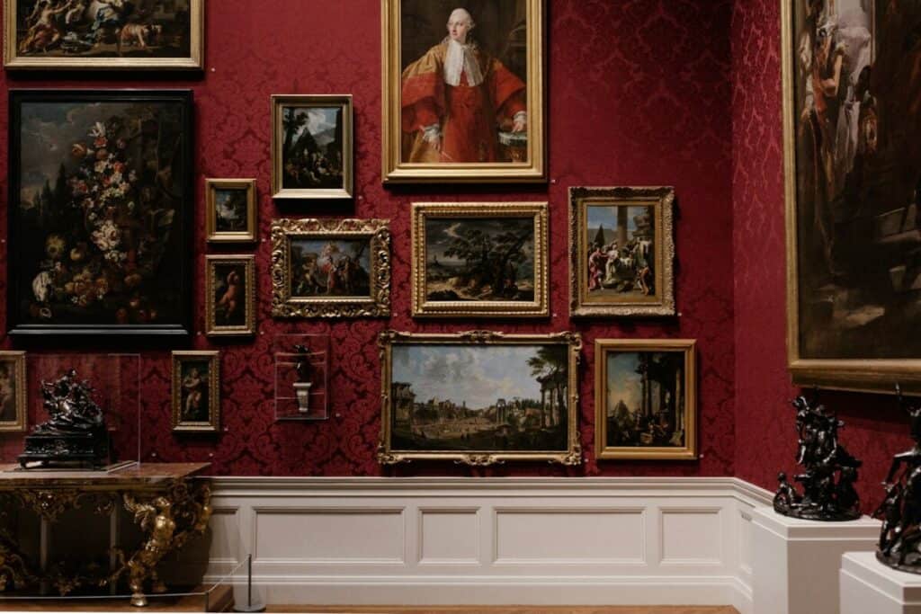assorted picture frames on museum wall