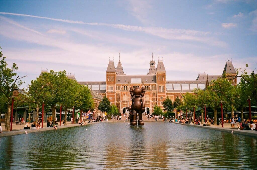 The Rijksmuseum | a large building with fountain in front of it