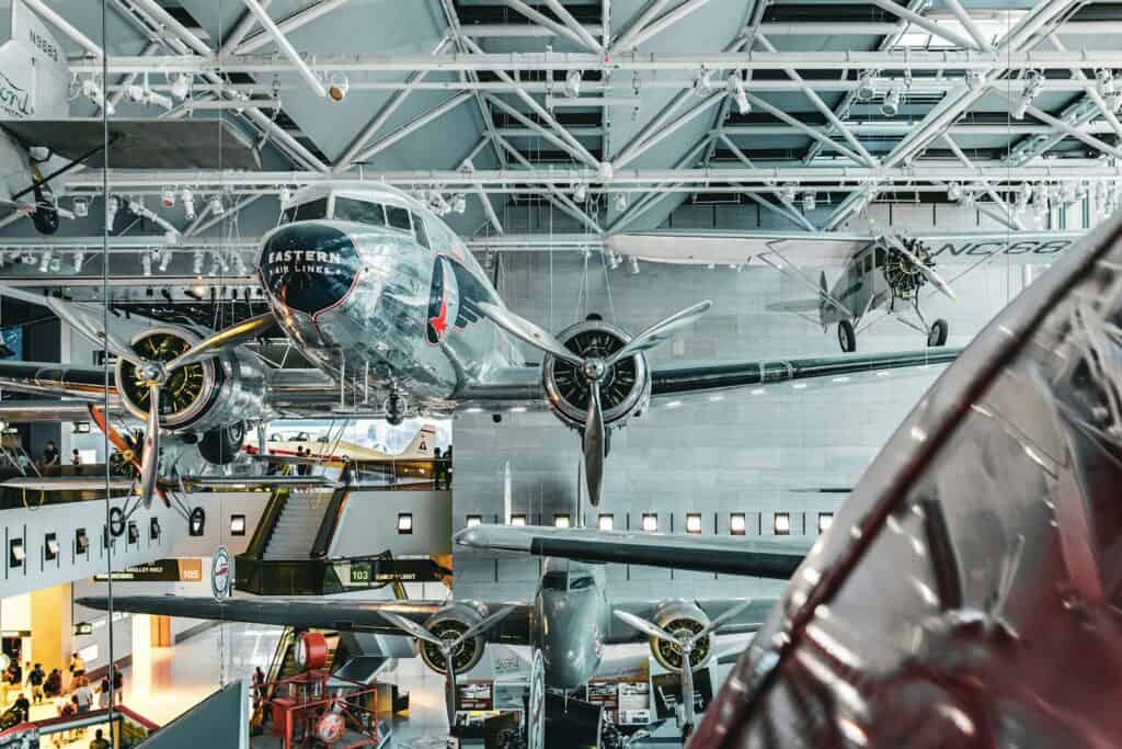 The Smithsonian National Air and Space Museum | a large airplane hanging from the ceiling of a building
