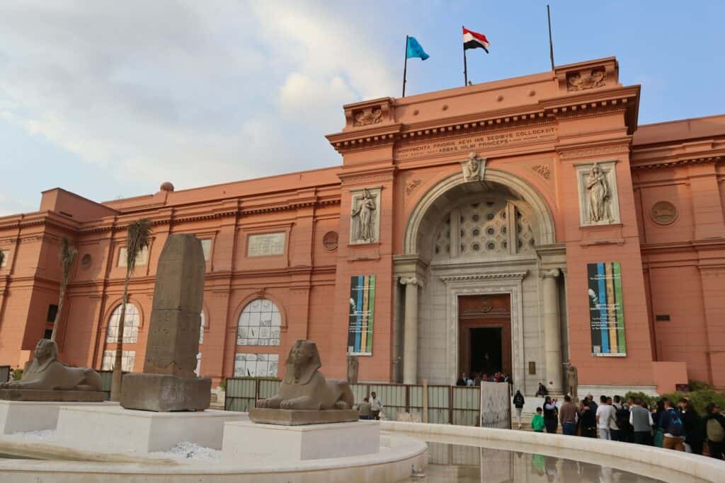 The Egyptian Museum | a group of people standing in front of a building