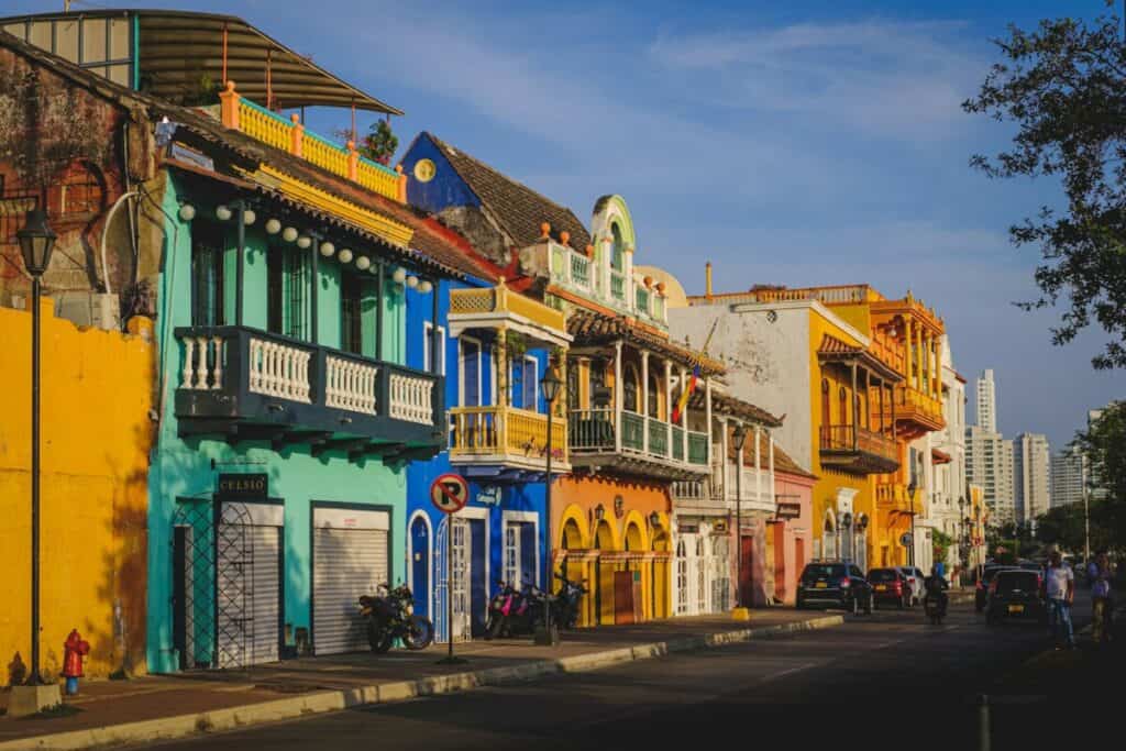 Cartagena, Colombia | cars parked in front of green and white concrete building during daytime