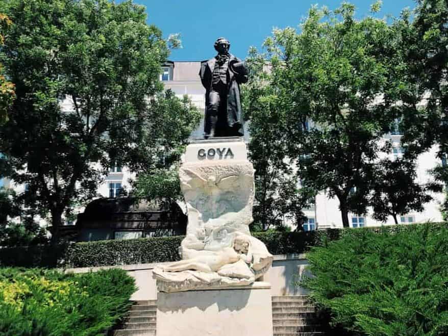 statue of man on top of a building